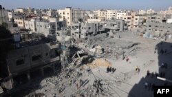 Palestinian civilians check the aftermath of an Israeli bombardment in Rafah in the southern Gaza Strip on Nov. 7, 2023.