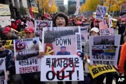 Demonstrators stage a rally against a recent deployment of North Korean troops to Russia, near the Seoul Central District Court in Seoul, South Korea, Nov. 15, 2024.