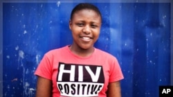 Nandi Makhele, 25, poses for a portrait while wearing a T-shirt indicating that she is HIV-positive, in Cape Town's Khayelitsha township February 15, 2010. Some 5.6 million people live with HIV/AIDS in South Africa - more than in any other country.