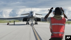 FILE - A B-1B Lancer arrives at Andersen Air Force Base, Guam, July 26, 2017, in this photo provided by the U.S.Air Force.