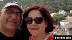 Anoosheh Ashoori is seen with his wife, Sherry Izadi, in a photo posted on her Twitter account. (@IzadiSherry)