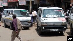Matatu minibuses sit idle in Nairobi as they wait for customers, December 19, 2011.