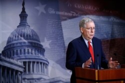 Senate Majority Leader Mitch McConnell of Kentucky speaks with reporters after the Senate approved a nearly $500 billion coronavirus aid bill, on Capitol Hill in Washington, April 21, 2020.