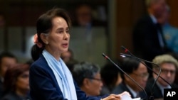 Myanmar's leader Aung San Suu Kyi addresses judges of the International Court of Justice for the second day of three days of hearings in The Hague, Netherlands, Dec. 11, 2019.
