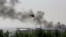A Ukrainian helicopter Mi-24 gunship fires cannons against rebels at the main airport in Donetsk, Ukraine, on May 26, 2014.