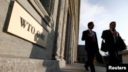 FILE - A scene just outside the doors of the World Trade Organization headquarters in Geneva.