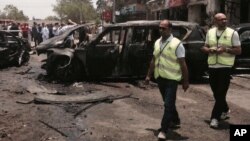 Emergency personnel inspect damage after a bomb attack targets Egypt's prosecutor general in the Heliopolis district of Cairo, June 29, 2015. 