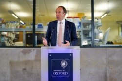 FILE - Britain's Health Secretary Matt Hancock delivers a speech on the COVID-19 vaccine program at the Jenner institute in Oxford, Britain, June 2, 2021.