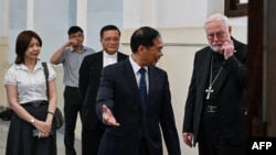 Vietnamese Foreign Minister Bui Thanh Son, second from right, welcomes the Vatican's foreign minister, Paul Gallagher, right, at the Foreign Ministry in Hanoi on April 9, 2024.