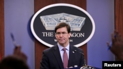 FILE - U.S. Defense Secretary Mark Esper speaks during a press briefing at Pentagon in Arlington, Virginia, Dec. 20, 2019. 