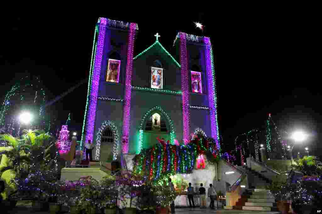 Burmese Christians gather outside the St. Anthony's Catholic Church Rangoon, Burma, December 25, 2012.