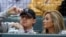FILE - Cleveland Browns quarterback Johnny Manziel, left, sits with Colleen Crowley during a baseball game in Arlington, Texas, April 14, 2015.