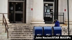 FILE - Mail boxes are seen on a sidewalk in New York City, August 14, 2020.