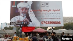 A billboard depicting Afghanistan's President Ashraf Ghani, who is seeking re-election, is displayed in Kabul, Afghanistan Sept. 25, 2019.