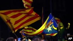 Catalonian pro-independence supporters celebrate in Barcelona, Spain, Sunday Sept. 27, 2015. 