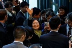 FILE - Taiwan President Tsai Ing-wen waves to supporters as she leaves a hotel for her return to Taiwan after her visit to Latin America in Burlingame, Calif., Jan. 14, 2017.