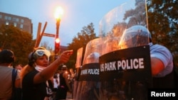 Protestors and police face off at Lafayette Park in front of the White House after police clashed with demonstrators trying to pull down the statue of U.S. President Andrew Jackson in the park during racial inequality protests in Washington.