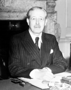 FILE - Britain's new Prime Minister Harold MacMillan at his desk at 10 Downing Street, London, Jan. 11, 1957.