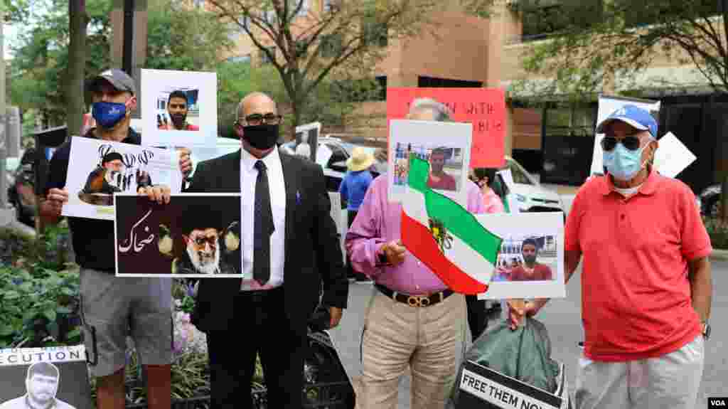  تجمع اعتراض به اعدام نوید افکاری مقابل دفتر حفاظت از منافع جمهوری اسلامی در واشنگتن - ایران افکاری را به قتل یک مامور امنیتی متهم کرده بود اما وکلا و خانواده نوید افکاری هرگونه دست داشتن او را رد کرده بودند. 