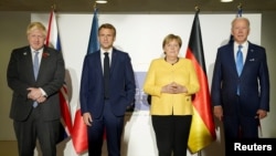 美國總統拜登、英國首相約翰遜、法國總統馬克龍和德國總理默克爾在羅馬舉行會晤（2021年10月30日）