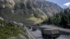FILE - An Indian army convoy moves along the Srinagar-Ladakh highway at Gagangeer, northeast of Srinagar, Indian-administered Kashmir, Sept. 9, 2020. Control over the Ladakh border region is a key friction point between India and China.