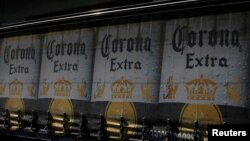 The logo of Corona beer, produced by a Group Modelo brewery in Mexico, is seen on a truck carrying bottles of beer in Mexico City, Jan. 27, 2017