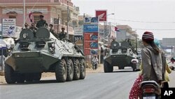 Armored personnel carriers of Cambodian Army drive through a road at Kampong Thom town, about 168 kilometers north of Phnom Penh, Cambodia - neighboring province to Preah Vihear of disputed 11th century Hindu Preah Vihear temple near border between Cambod