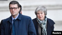 Britain's Prime Minister Theresa May returns to Downing Steet in London, Britain, December 17, 2018.