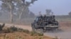 FILE - Members of the Cameroonian Rapid Intervention Battalion patrol on the outskirts of Mosogo in the far north region of the country, March 21, 2019.