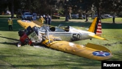 An airplane flown by actor Harrison Ford sits on the ground after crash-landing at Penmar Golf Course in Venice, California, March 5, 2015.