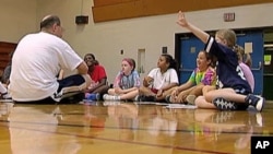 Coach Andy Stadnik of the Amateur Athletic Union and his basketball team talk about the importance of ethics in sports and life, Oct 2010
