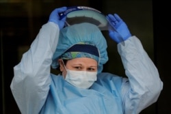 A nurse works at a drive-thru testing site for the coronavirus disease (COVID-19) at North Shore University Hospital in Manhasset, New York, May 6, 2020.