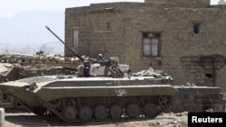 An armored military vehicle is seen near the vicinity of the presidential palace in Sana'a, Yemen, April 2, 2015. 