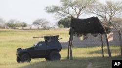 FILE - An armored vehicle is seen parked near the joint anti-Boko Haram task force headquarters in Maiduguri, Nigeria, Sept. 26, 2011. The radical sect is the gravest security threat to Africa's most populous nation.