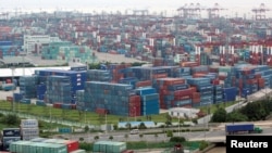 FILE - A container port in Shanghai, Aug. 11, 2009. China's trade surplus with the United States rose in June, July, August and September.