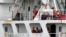 Crew members of the Panama-flagged cargo ship MV Asphalt Venture look out from the ship at the Kenyan Port of Mombasa, April 28, 2011. 