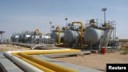 FILE - A general view of an oil refinery in Al-Jbessa oil field in Al-Shaddadeh town of Al-Hasakah gorvernate, Syria, April 1, 2010. 