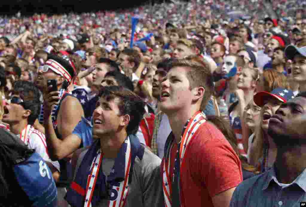 Fans watch as Belgium scores against the U.S. during the Brazil 2014 World Cup viewing party at Solider Field in Chicago, July 1, 2014.