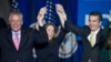Virginia's governor-elect, Ralph Northam, right, celebrates his election win with Virginia Governor Terry McAuliffe and his wife, Dorothy, in Fairfax, Virginia. Nov. 7, 2017.