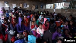 FILE - Eritrean refugees wait to get registered on arrival at the Indabaguna refugee reception and screening center in Ethiopia's Tigrai region near the Eritrean border, Feb. 9, 2016. 