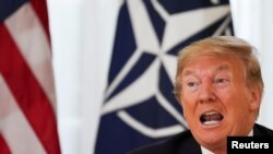 Presiden AS Donald Trump dalam pertemuan dengan Sekjen NATO Jens Stoltenberg (tidak nampak dalam gambar) menjelang dimalinya KTT NATO di Watford, London, Inggris, 3 Desember 2019.