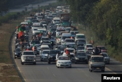 A view of a convoy by supporters of the former Pakistani Prime Minister Imran Khan's party Pakistan Tehreek-e-Insaf (PTI), as they head towards Islamabad, during an anti-government rally, in Peshawar, Nov. 24, 2024.