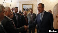 Russia's Foreign Minister Sergei Lavrov (R) meets with Syrian opposition leaders in Moscow July 11, 2012. 