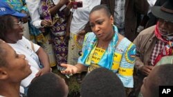 Olive Lembe Kabila (C), the wife of President Joseph Kabila speaks to women during a march dubbed World March of Women in Bukavu, South Kivu Province, 17 Oct 2010.