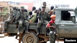 Congolese soldiers are seen on a pick-up truck after dispersing civilians protesting against what they say is the government's failure to stop killings and inter-ethnic tensions in the town of Butembo, North Kivu province, DRC, Aug. 24, 2016.