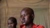 Sixteen-year-old Akuot, shown here in Bor, Jonglei state, in Feburary 2013, was beaten for three days after she refused to be married off in exchange for a dowry of cattle. 