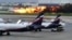 This image taken from video provided by Instagram user @artempetrovich, shows the SSJ-100 aircraft of Aeroflot Airlines on fire during an emergency landing in Sheremetyevo airport in Moscow, Russia, May 5, 2019. 