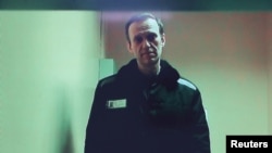Russian opposition leader Alexey Navalny is seen on a screen via video link from a penal colony in the Vladimir Region during a hearing at the Basmanny district court in Moscow, Russia April 26, 2023.