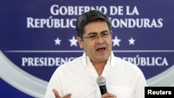 FILE - Honduran President Juan Orlando Hernandez holds a news conference at the Presidential House in Tegucigalpa, Honduras, Oct. 3, 2019.