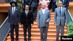 Presidents (from L) Salvar Kiir of South Sudan, Joseph Kabila of DRC, Yoweri Museveni of Uganda and Paul Kagame of Rwanda before the start of the extraordinary summit of the International Conference on the Great Lakes Region (ICGLR) head of states emergen